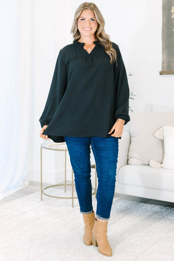 Plus Size black long sleeve top with a ruffled split neckline and a relaxed, flowy fit.