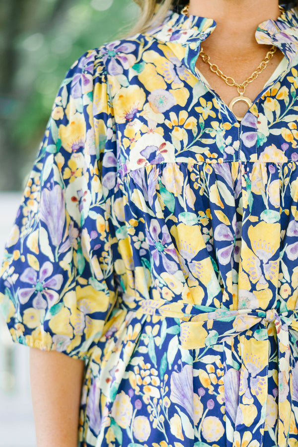 Plus Size navy floral midi dress with puff sleeves, a tiered skirt, and a matching waist tie.