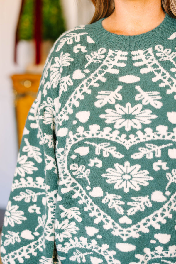 Plus size green and white fair isle heart sweater with a relaxed, flowy fit.