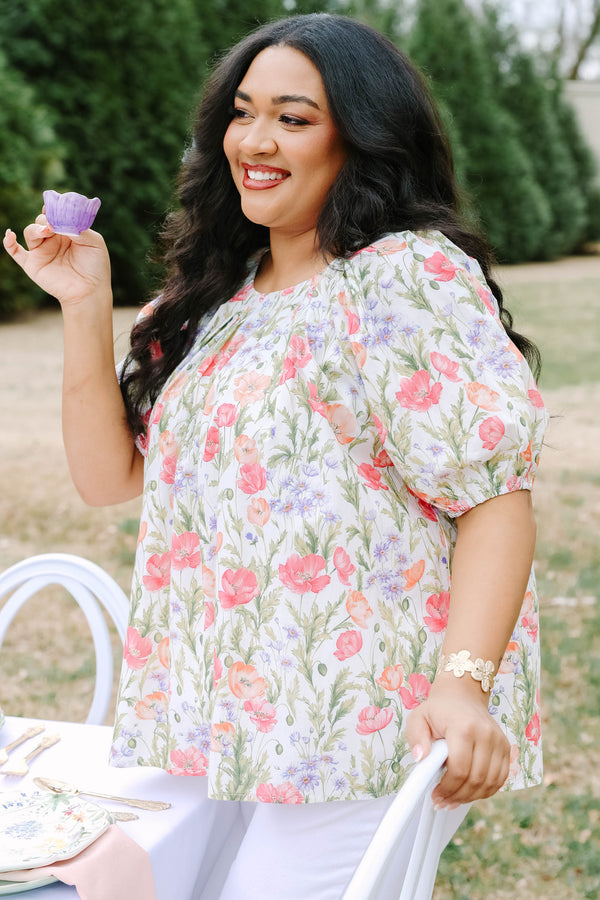 Chic Soul plus size clothing, white top with short bubble sleeves that has a green floral pattern throughout 