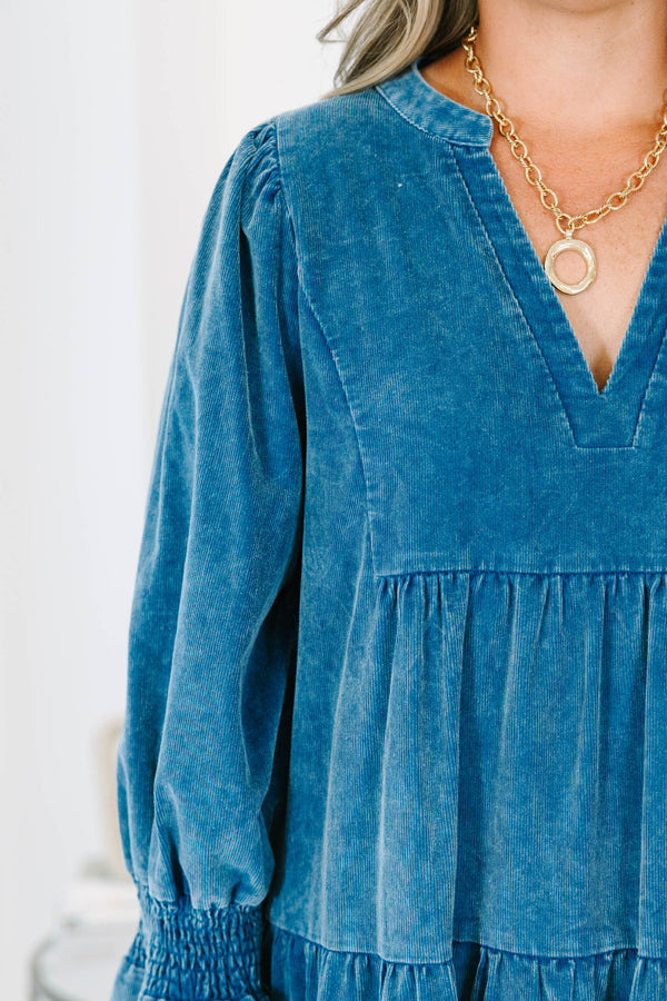 Plus Size blue corduroy tiered dress with a V-neckline and ruffled elbow-length sleeves.