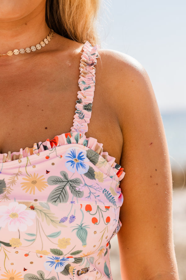 Chic Soul plus size clothing, thin-strapped pale pink one-piece swimsuit with subtle ruffled detailing along neckline and straps with a sweetheart neckline and a multi-colored floral pattern