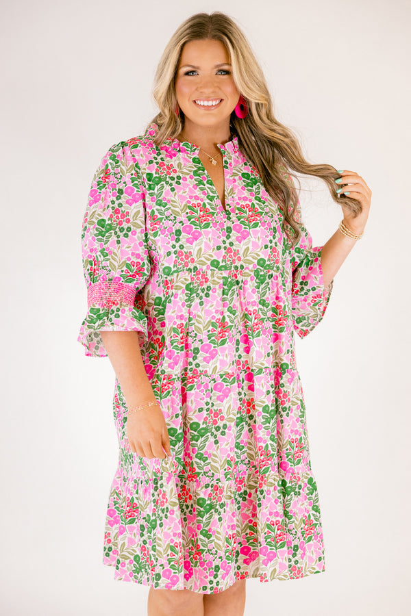 Chic Soul plus size clothing, pink multi color knee length dress with half sleeves that have a ruffle detail on the bottom of each sleeve and pink stitching details above the ruffle as well as a floral pattern 