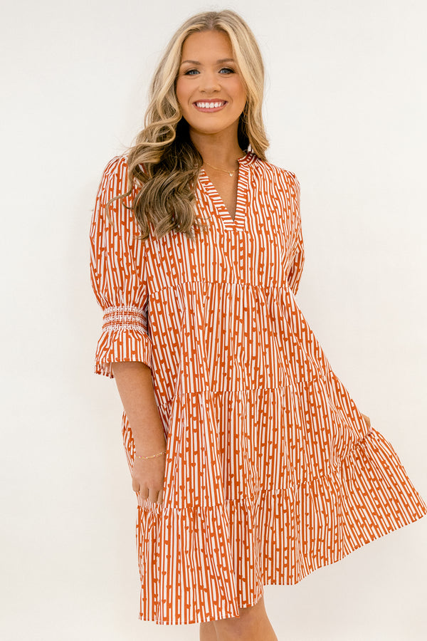 Chic Soul plus size clothing, red and orange abstract pattern mid sleeve short tiered dress with v-neckline and cinching at the ends of the sleeves