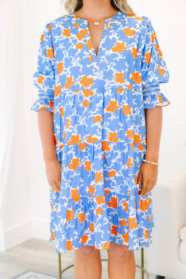 Plus Size tiered mini dress in a blue and orange floral print with a V-neckline and short sleeves.