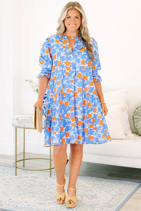 Plus Size tiered mini dress in a blue and orange floral print with a V-neckline and short sleeves.
