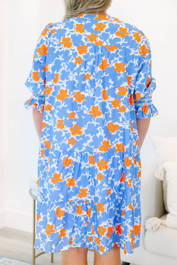 Plus Size tiered mini dress in a blue and orange floral print with a V-neckline and short sleeves.