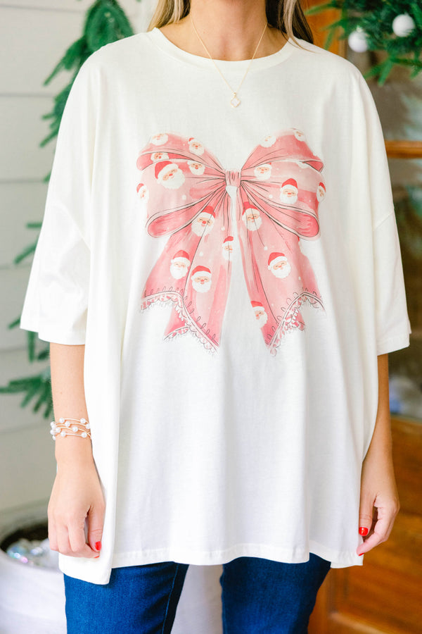 Chic Soul plus size clothing, ivory oversized boyfriend tee with large red Santa print bow in the middle