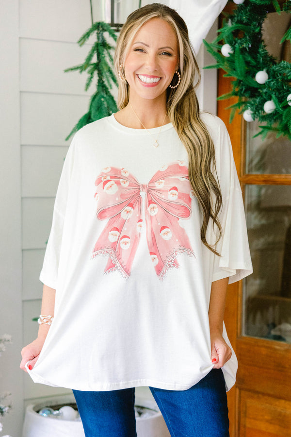 Chic Soul plus size clothing, ivory oversized boyfriend tee with large red Santa print bow in the middle
