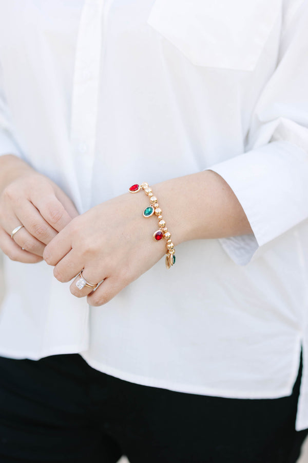 Plus Size gold beaded charm bracelet featuring alternating red and green oval gemstone drops.