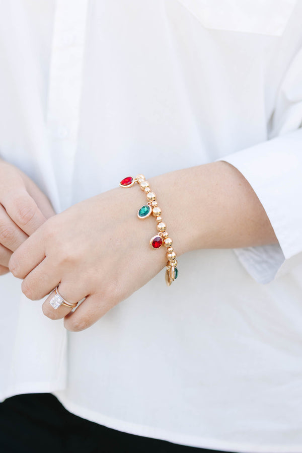 Plus Size gold beaded charm bracelet featuring alternating red and green oval gemstone drops.