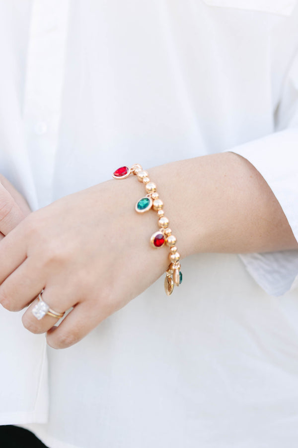Plus Size gold beaded charm bracelet featuring alternating red and green oval gemstone drops.