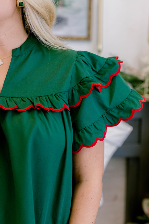 Chic Soul plus size clothing, dark green short flutter sleeve top with red scalloped trim along layered flutter sleeve
