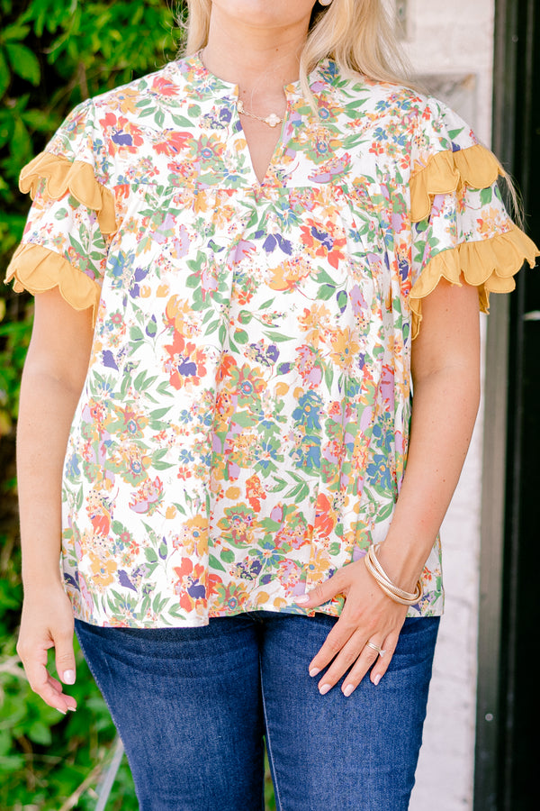 Chic Soul plus size clothing, white and multi colored floral print short sleeve top with orange scallop trim on sleeves