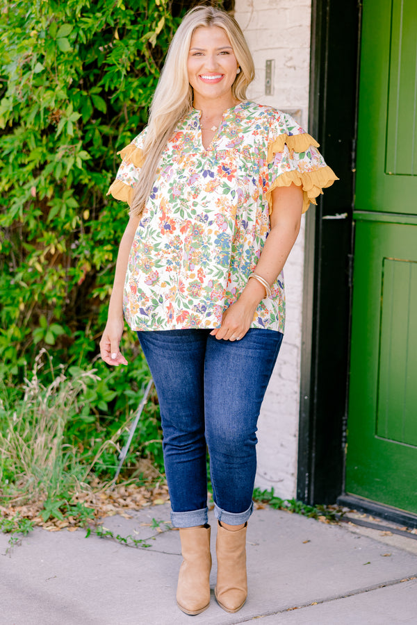 Chic Soul plus size clothing, white and multi colored floral print short sleeve top with orange scallop trim on sleeves