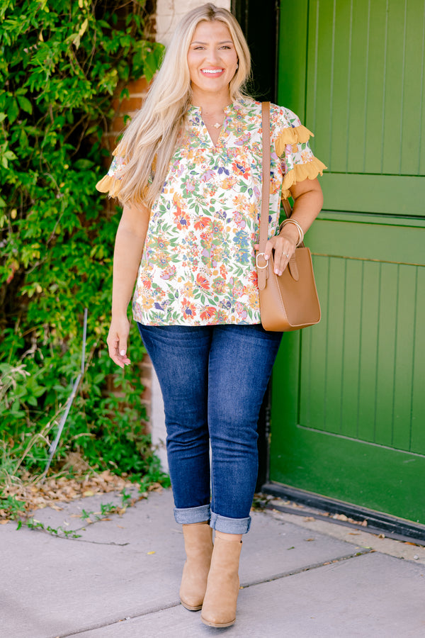 Chic Soul plus size clothing, white and multi colored floral print short sleeve top with orange scallop trim on sleeves