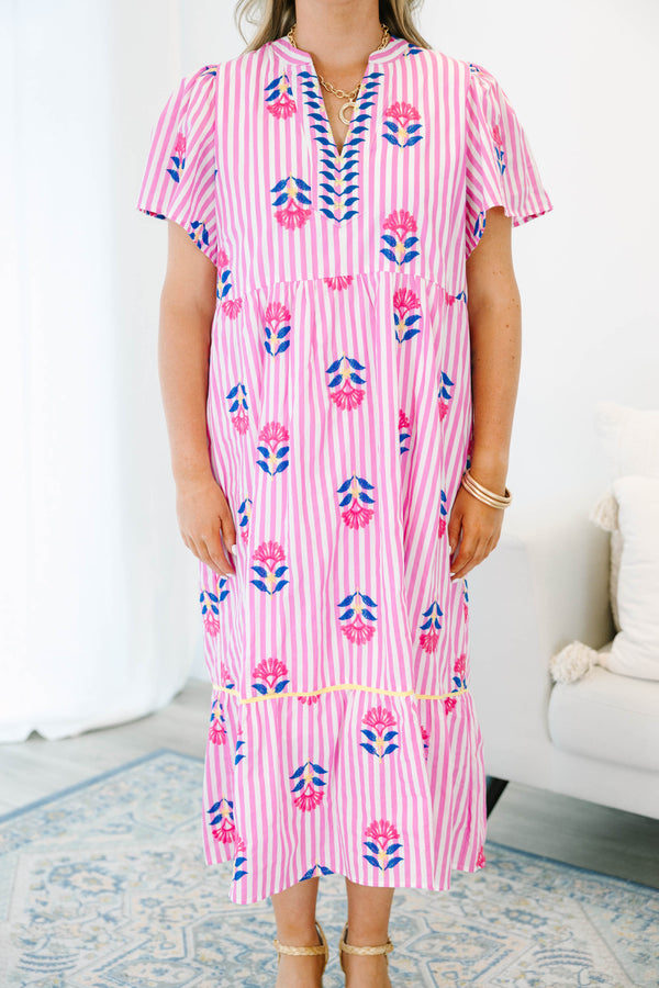 Plus size pink striped midi dress with floral embroidery, flowy fit, and short flutter sleeves.