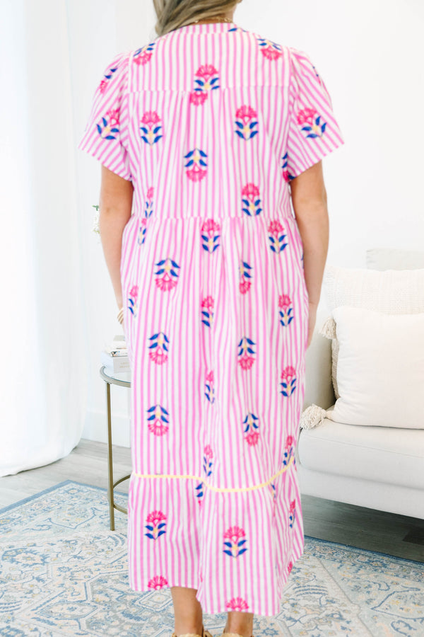 Plus size pink striped midi dress with floral embroidery, flowy fit, and short flutter sleeves.