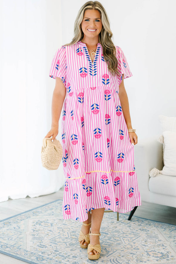 Plus size pink striped midi dress with floral embroidery, flowy fit, and short flutter sleeves.