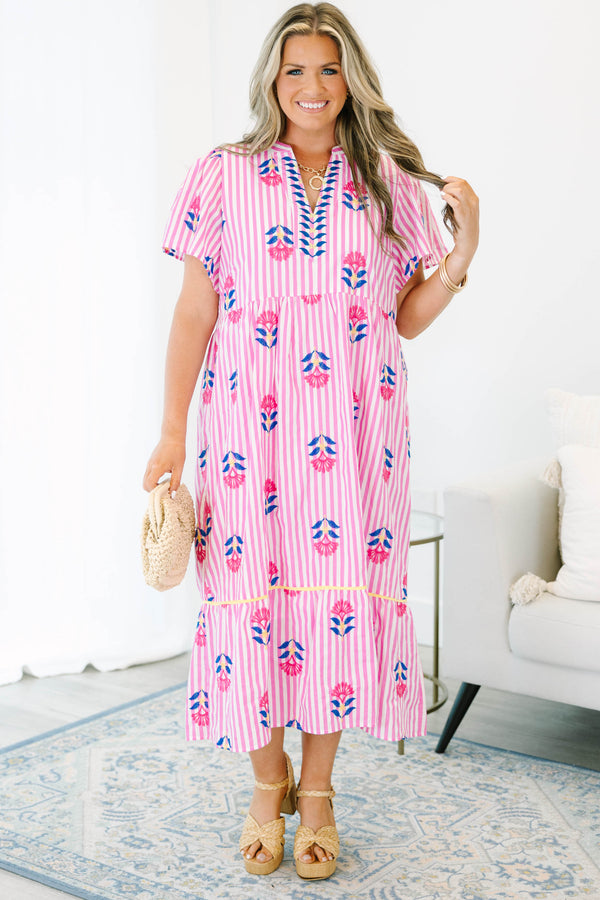 Plus size pink striped midi dress with floral embroidery, flowy fit, and short flutter sleeves.