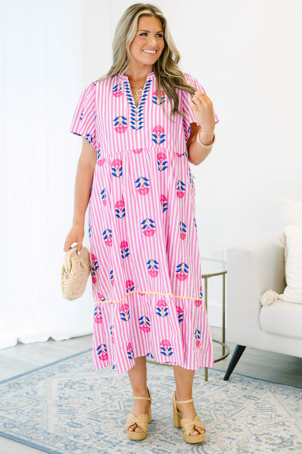 Plus size pink striped midi dress with floral embroidery, flowy fit, and short flutter sleeves.