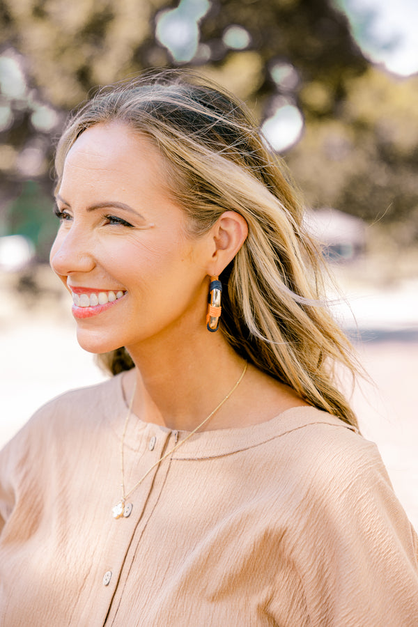 Chic Soul plus size clothing, gold hoop earrings with orange and navy woven segments throughout each hoop