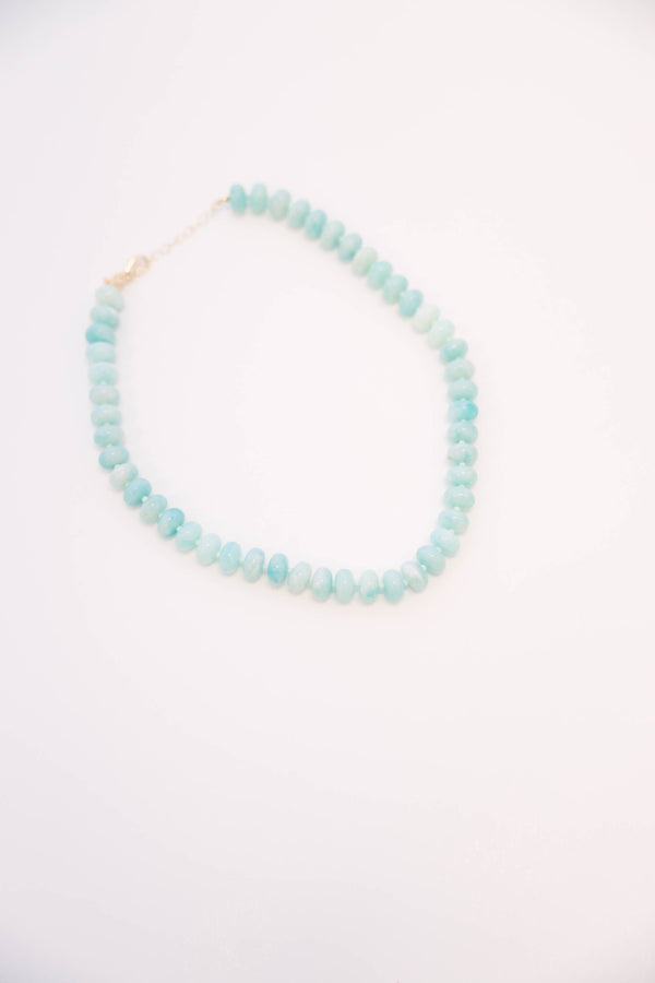 Plus Size seafoam green beaded necklace with rounded stones and a gold-toned clasp.