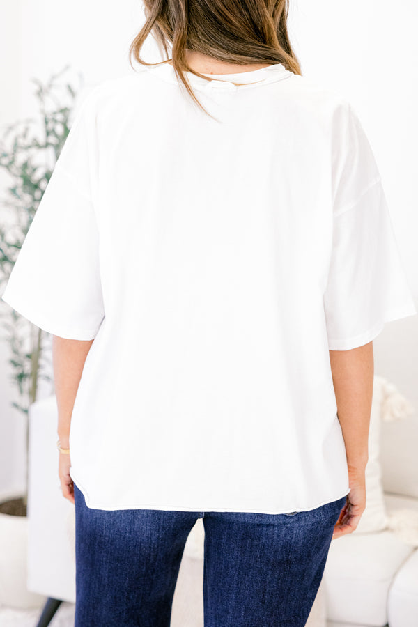 Chic Soul plus size clothing, white short sleeve slightly cropped vintage wash tee with “‘Tis The Season” in red blue and white plaid text on the front