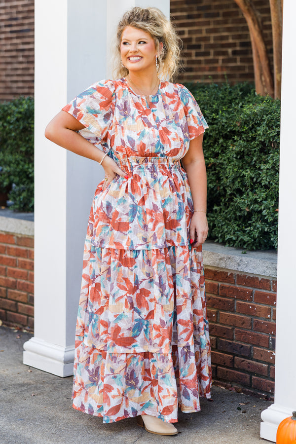 Chic Soul plus size clothing, short-sleeve rust maxi dress with smocked waistline and v-neckline with ruffled detailing and purple multi-colored watercolor floral pattern
