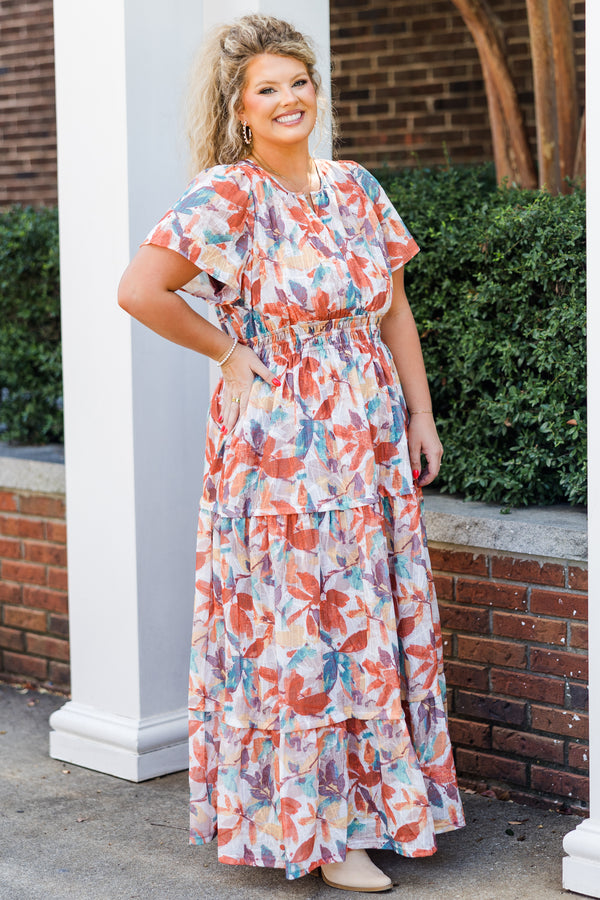 Chic Soul plus size clothing, short-sleeve rust maxi dress with smocked waistline and v-neckline with ruffled detailing and purple multi-colored watercolor floral pattern
