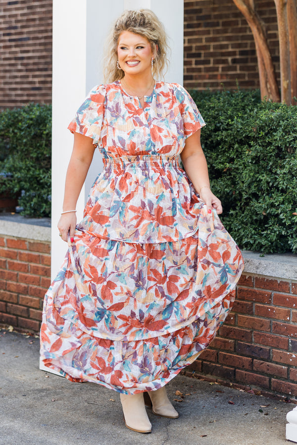 Chic Soul plus size clothing, short-sleeve rust maxi dress with smocked waistline and v-neckline with ruffled detailing and purple multi-colored watercolor floral pattern
