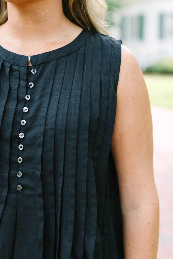 Plus Size black sleeveless top with vertical pleats, a button-down front, and a round neckline.
