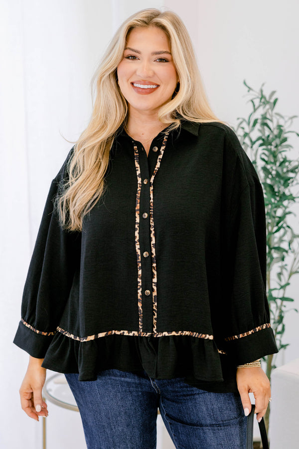 Chic Soul plus size clothing, black long sleeve top with a flare at the bottom as well as leopard stitching details at the bottom of each sleeve going down the center of the shirt and on the bottom of the shirt 