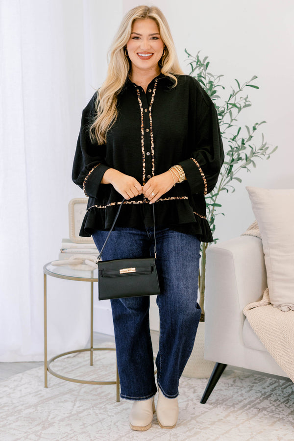 Chic Soul plus size clothing, black long sleeve top with a flare at the bottom as well as leopard stitching details at the bottom of each sleeve going down the center of the shirt and on the bottom of the shirt 