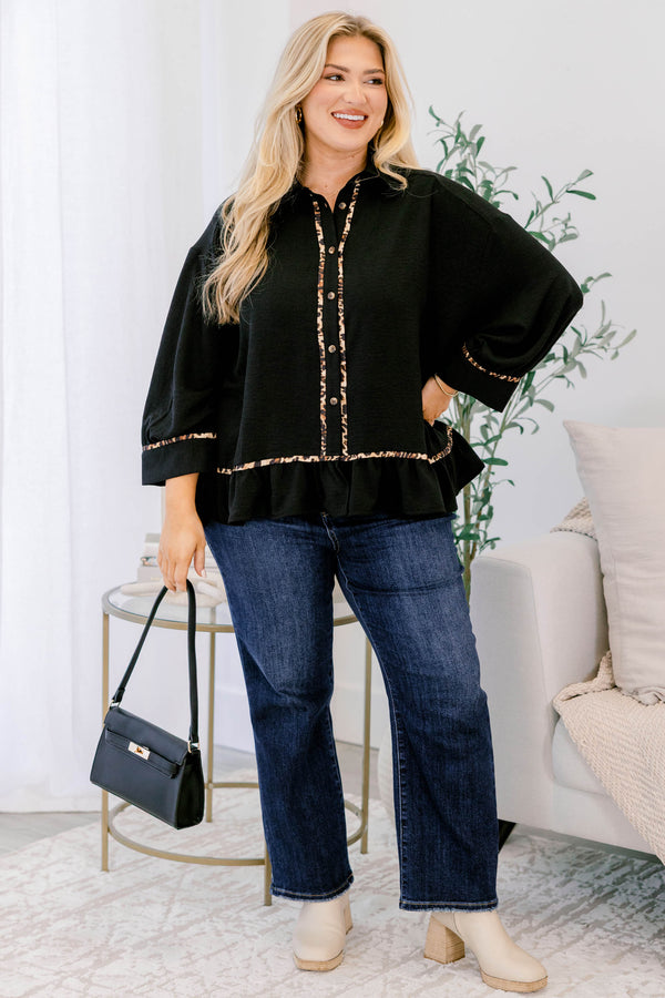 Chic Soul plus size clothing, black long sleeve top with a flare at the bottom as well as leopard stitching details at the bottom of each sleeve going down the center of the shirt and on the bottom of the shirt 