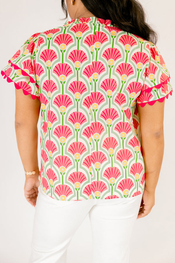 Chic Soul plus size clothing, pink top with flutter sleeves that have a pink scalloped detail outlining the ends of each ruffle as well as going along the v-neckline and a floral block pattern throughout 