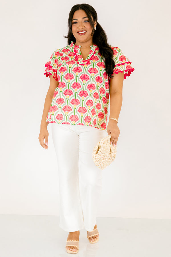 Chic Soul plus size clothing, pink top with flutter sleeves that have a pink scalloped detail outlining the ends of each ruffle as well as going along the v-neckline and a floral block pattern throughout 