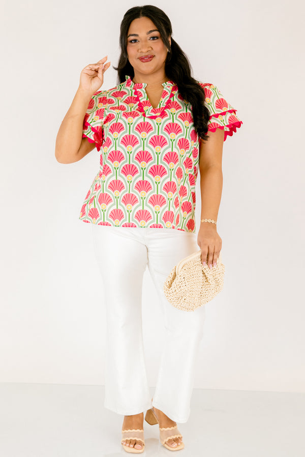 Chic Soul plus size clothing, pink top with flutter sleeves that have a pink scalloped detail outlining the ends of each ruffle as well as going along the v-neckline and a floral block pattern throughout 
