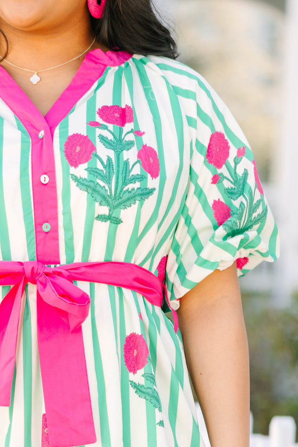 Chic Soul plus size clothing, green striped tiered maxi dress with a pink strip outlining the v-neckline and going down to the bottom of the buttons on the chest as well as a pink belt that ties around the waist and floral block pattern throughout