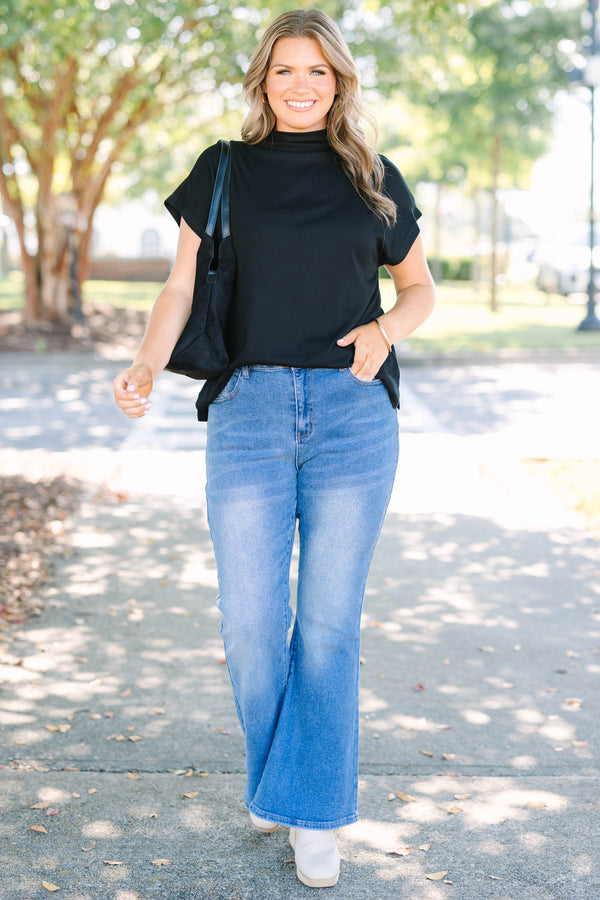Plus Size medium wash flare jeans with a high-waisted fit and classic five-pocket styling.