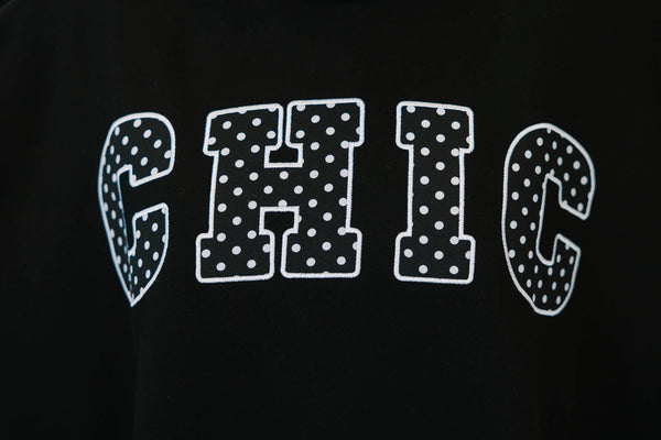 Plus Size black mock neck pullover with white polka dot 