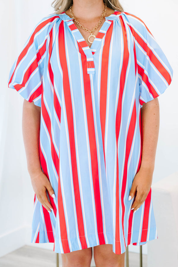 Plus size blue and red vertical striped shift dress with puff sleeves and a v-neckline.
