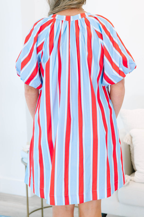 Plus size blue and red vertical striped shift dress with puff sleeves and a v-neckline.