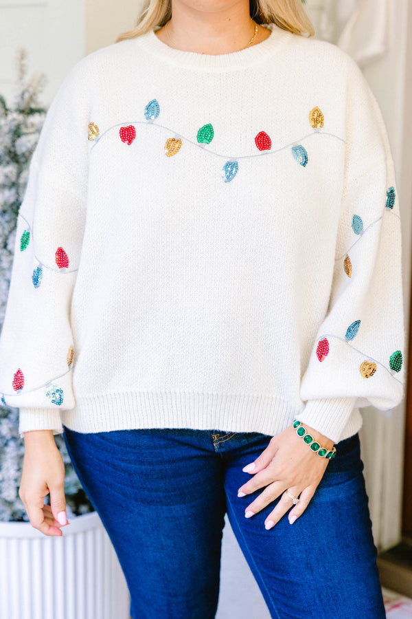 Chic Soul plus size clothing, cream knit sweater with a string of Christmas lights across the chest and sleeves