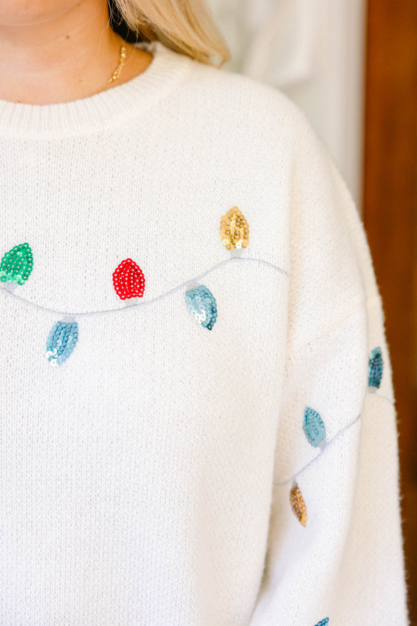 Chic Soul plus size clothing, cream knit sweater with a string of Christmas lights across the chest and sleeves