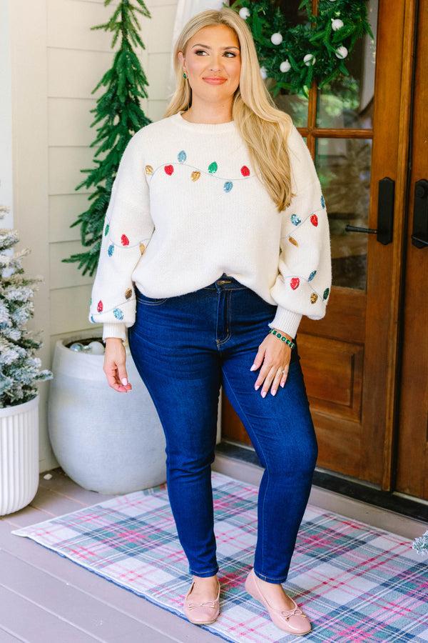 Chic Soul plus size clothing, cream knit sweater with a string of Christmas lights across the chest and sleeves