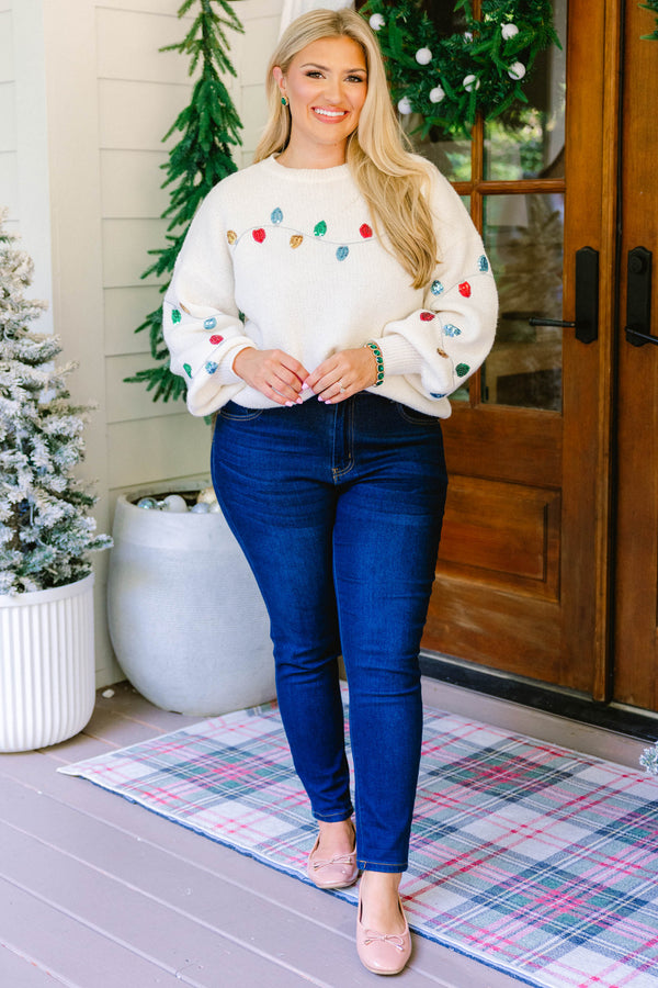 Chic Soul plus size clothing, cream knit sweater with a string of Christmas lights across the chest and sleeves
