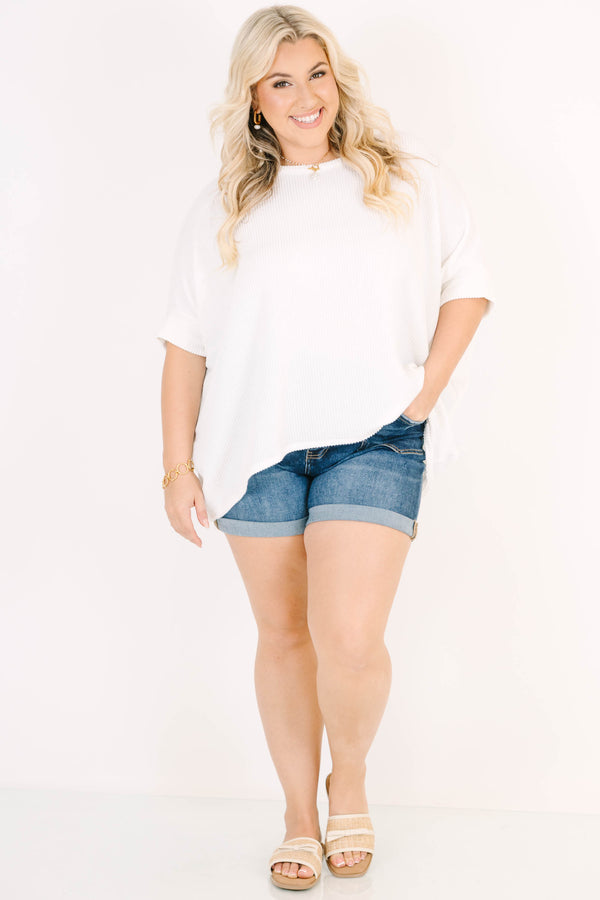 Plus Size dark wash denim shorts with a button-up fly, cuffed hems, and front seam detailing.
