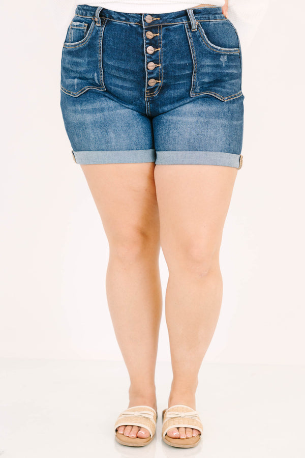 Plus Size dark wash denim shorts with a button-up fly, cuffed hems, and front seam detailing.