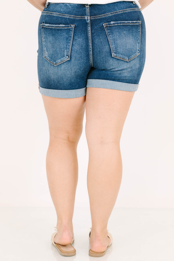 Plus Size dark wash denim shorts with a button-up fly, cuffed hems, and front seam detailing.